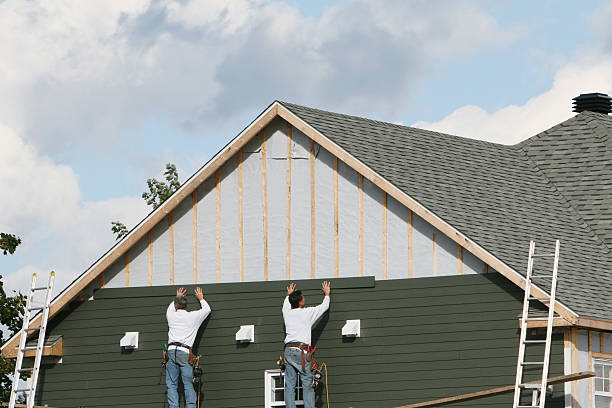 Professional Storm Damage Siding Repair technician working in Fulton, IL